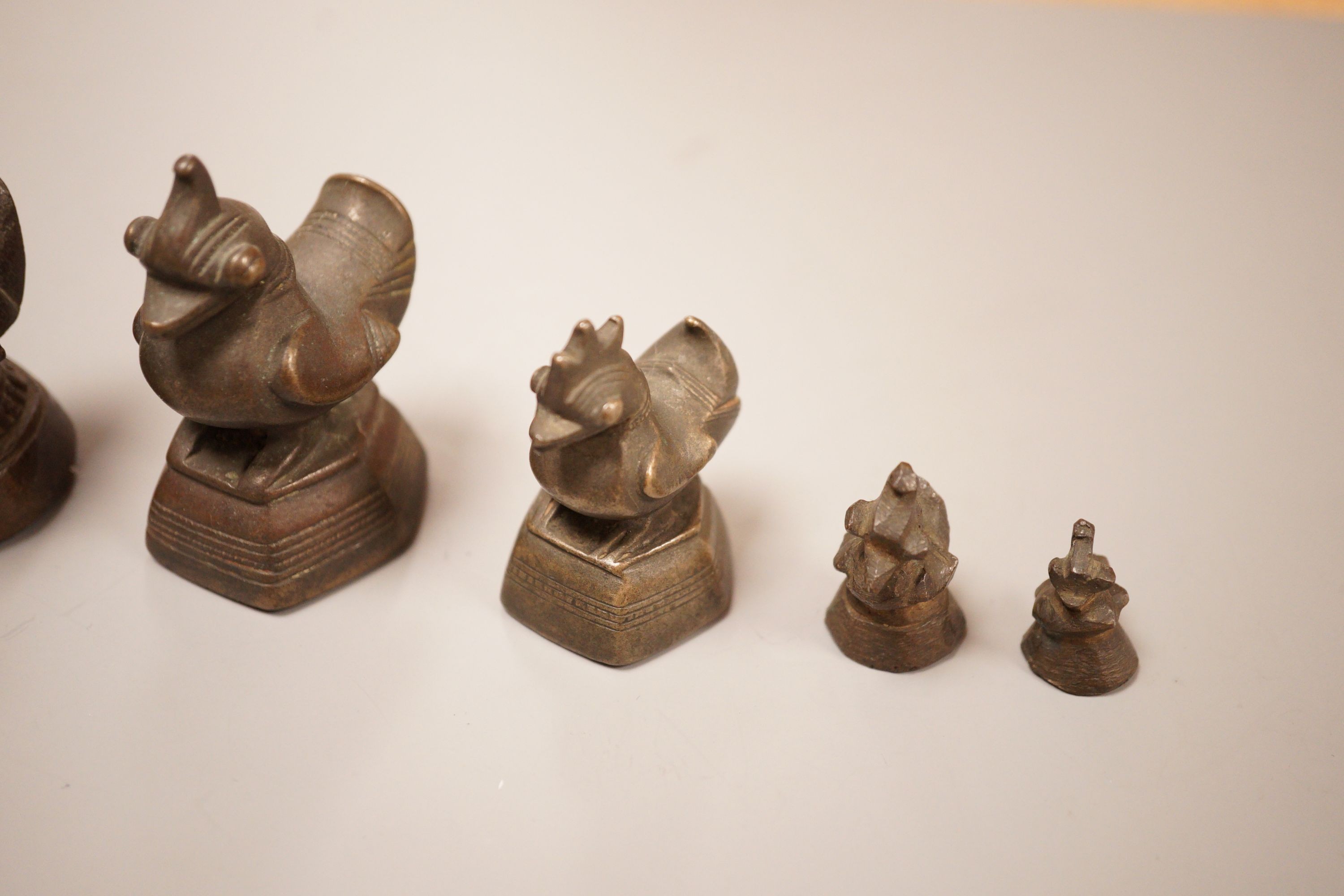 Six Burmese bronze duck opium weights, tallest 7cm